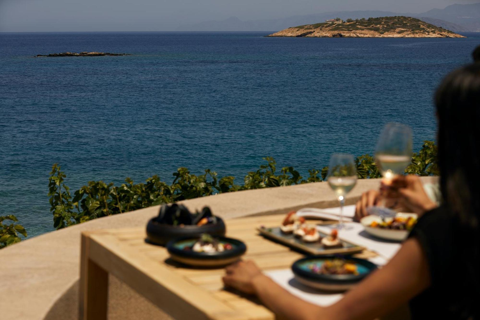Minos Palace Resort - Adults Only Agios Nikolaos  Exterior photo A woman eating meze
